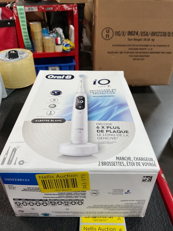 Photo 1 of Oral-B iO Deep Clean + Protect Rechargeable Electric Toothbrush, White with a iO Series 7 Toothbrush, 2 Replacement Brush Heads, and a Charging Travel Case