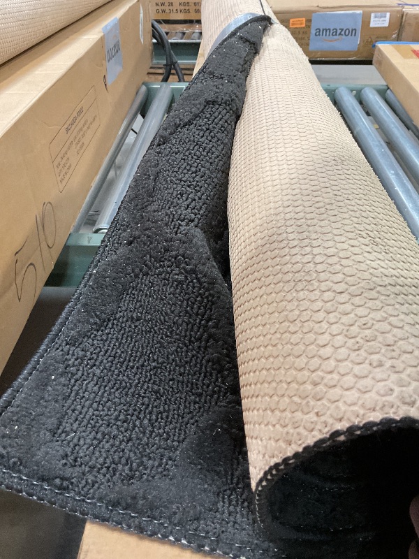 Photo 1 of **DIRT. MINOR USE WEAR**Garland Rug Sparta Non Slip Polypropylene 5 Ft. X 7 Ft. Black Area Rug- Ideal for Living Rooms & Hallways, Stylish & Durable for High-Traffic Areas