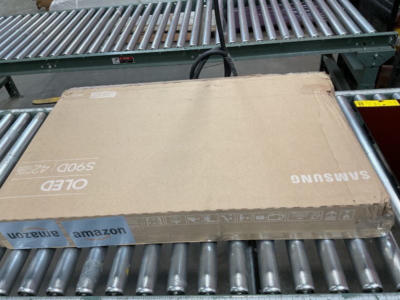 Photo 1 of *** CRACKED NO PICTURE AND BENT POSSIBLY USE FOR PARTS*** Samsung 42-Inch Class OLED 4K S90D Series HDR Smart TV w/Dolby Atmos, Object Tracking Sound Lite, Motion Xcelerator, Real Depth Enhancer, 4K AI Upscaling, Alexa Built-in (QN42S90D, 2024 Model)