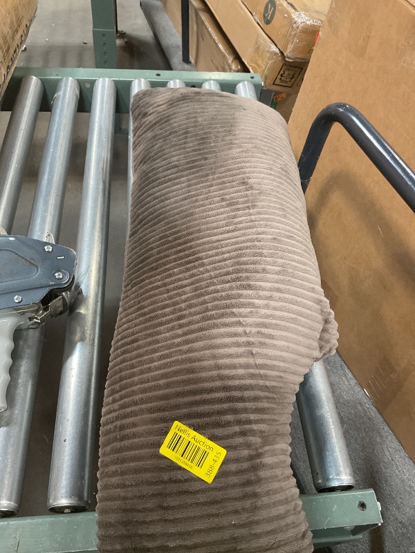 Photo 1 of **DIRT FROM TRANSPORT**Brown pillow