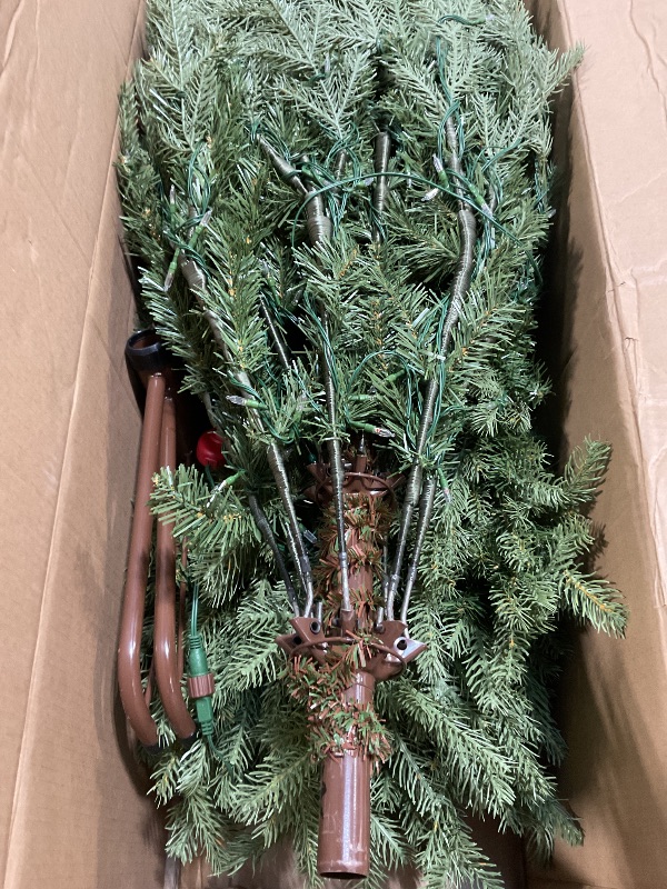Photo 1 of *** USED***National Tree Company 7.5 ft Pre-Lit Nordic Spruce Slim Artificial Christmas Tree, 600 LED Lights, 3,268 Tips, Foot Pedal, 10 Light Functions, Includes Stand, Green