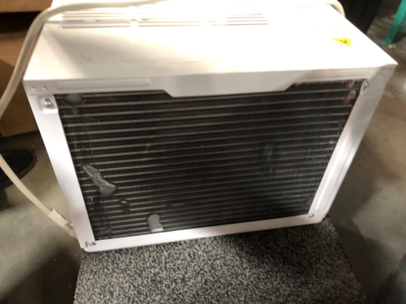 Photo 7 of ***USED - MAJOR DAMAGE - DENTED - NO PACKAGING - MISSING ACCESSORIES - SEE PICTURES - UNABLE TO TEST***
Keystone 12,000 BTU Window Air Conditioner with Dehumidifier and Supplemental Heat, 230V, Window AC for Medium Rooms up to 550 Sq. Ft. with Remote Cont