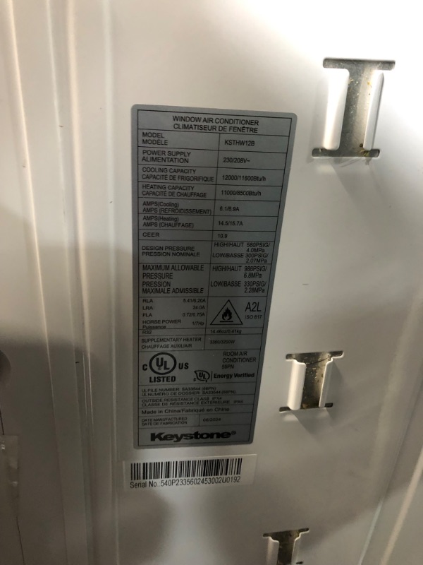 Photo 4 of ***USED - MAJOR DAMAGE - DENTED - NO PACKAGING - MISSING ACCESSORIES - SEE PICTURES - UNABLE TO TEST***
Keystone 12,000 BTU Window Air Conditioner with Dehumidifier and Supplemental Heat, 230V, Window AC for Medium Rooms up to 550 Sq. Ft. with Remote Cont