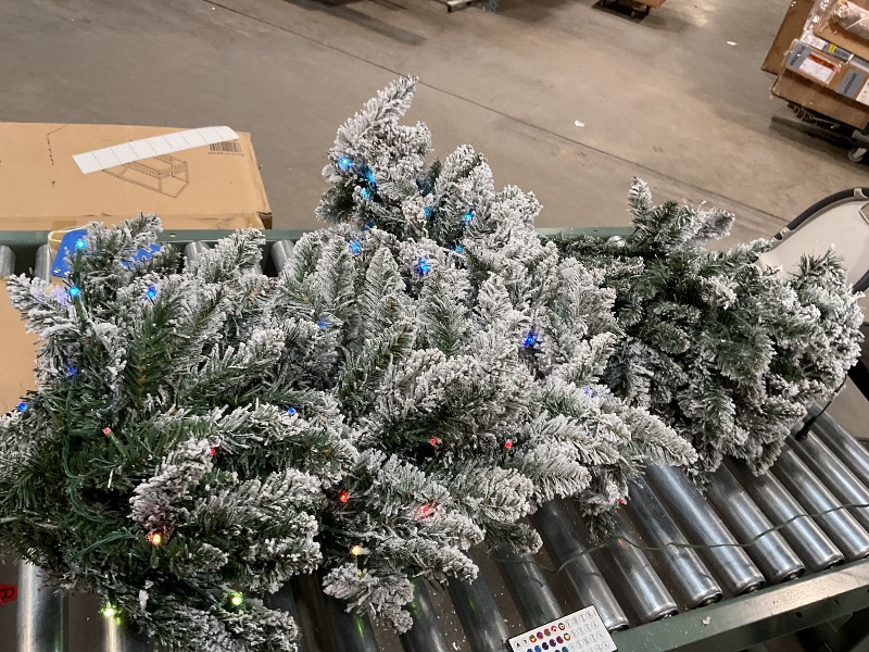 Photo 2 of National Tree Company Pre-Lit 'Feel Real' Artificial Slim Downswept Christmas Tree, Green, Douglas Fir, Dual Color LED Lights, Includes PowerConnect and Stand, 6.5 feet it looks like someone used this Christmas tree and may have sprayed it with the fake s