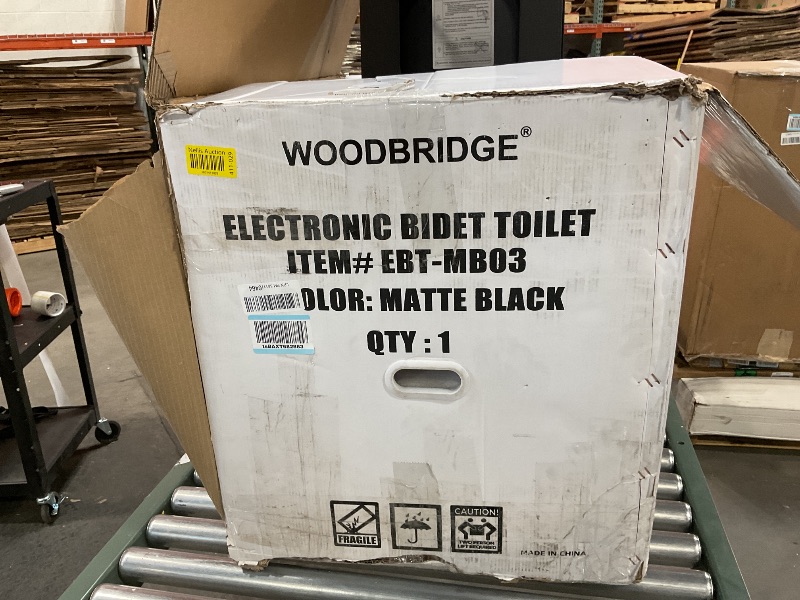 Photo 5 of *FOR PARTS ONLY* WOODBRIDGE Square Smart Bidet Toilet with Auto Open & Close, Foot Sensor, Auto Flush, Multiple Spray Modes, Heated Seat, Warm Water and Air Dryer, Auto LED Nightlight, Matte Black, EBT-MB03 It appears the side of me have been used once or