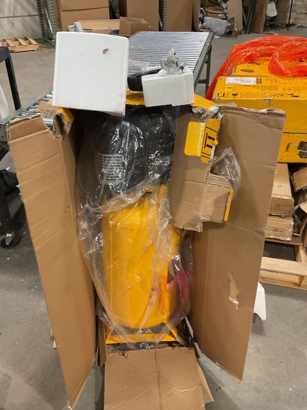 Photo 4 of DEWALT 15 Gal. 200 PSI Portable Electric Air Compressor  This item seem to bear in the oringina factory seal new and unused are parts were found ion box as pictured