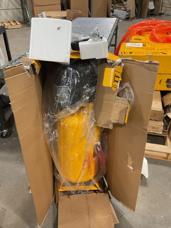 Photo 2 of DEWALT Vertical Portable Compressor, 1.9 Hp 200 Psi Oil Free High Pressure Low Noise (D55168) This item seem to bear in the oringina factory seal new and unused are parts were found ion box as pictured