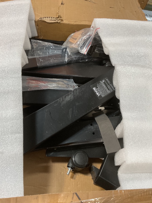 Photo 1 of ***LOOSE BOLTS COULD BE IN BOX*** VEVOR L Shaped Standing Desk with Wheels, 63 x 55 inch 3-Level Height Adjustable Electric Corner Standing Desk with Power Outlet, Heavy Duty Carbon Steel Sit Stand Computer Table, Easy to Assemble