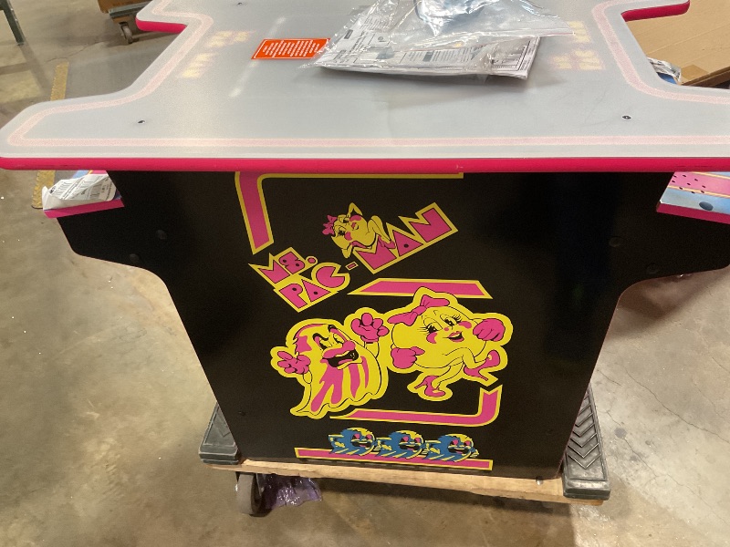 Photo 1 of ***UNTESTED AND PARTS MAYBE NEEDED FOR INSIDE*** Arcade1Up Ms.PAC-Man Head-to-Head Arcade Machine – Retro Home Arcade Table with 12 Classic Games, Light-Up Control Deck & Real-Feel Joysticks