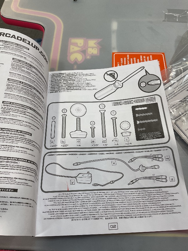 Photo 1 of ***UNTESTED AND PARTS MAYBE NEEDED FOR INSIDE*** Arcade1Up Ms.PAC-Man Head-to-Head Arcade Machine – Retro Home Arcade Table with 12 Classic Games, Light-Up Control Deck & Real-Feel Joysticks