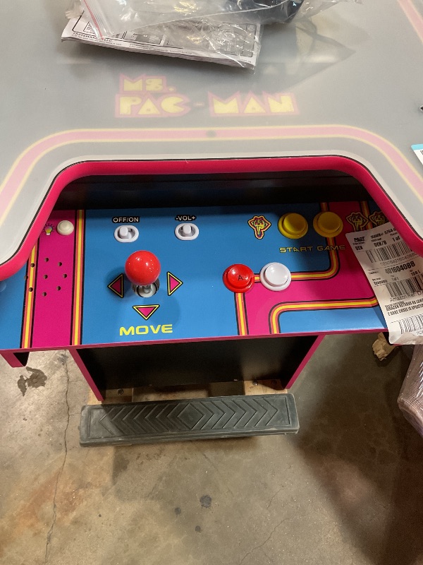 Photo 1 of ***UNTESTED AND PARTS MAYBE NEEDED FOR INSIDE*** Arcade1Up Ms.PAC-Man Head-to-Head Arcade Machine – Retro Home Arcade Table with 12 Classic Games, Light-Up Control Deck & Real-Feel Joysticks