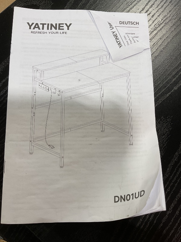 Photo 1 of ***HARDWARE  LOOSE IN PACKAGE*** YATINEY Small Computer Desk with Charging Station and LED Lights, Gaming Desk with Monitor Stand, 2-Tier Home Office Desk with 4 Side Hooks, for Living Room, Home Office, Black DN01UDBBY2