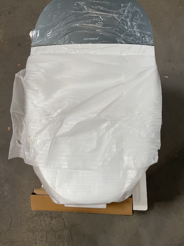 Photo 1 of *** MINOR DAMAGE ***WOODBRIDGE Smart Toilet, Auto Open & Close, Auto Flush, Foot Sensor, Cleaning Foam Dispenser, Heated Seat and Chair Height Design, EBT230