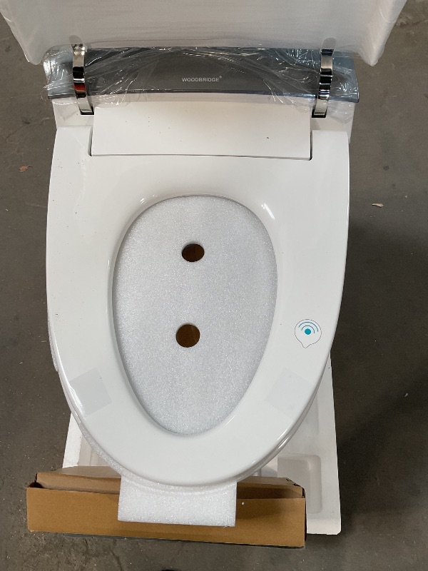 Photo 1 of *** MINOR DAMAGE ***WOODBRIDGE Smart Toilet, Auto Open & Close, Auto Flush, Foot Sensor, Cleaning Foam Dispenser, Heated Seat and Chair Height Design, EBT230