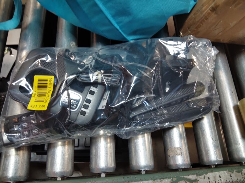 Photo 1 of ***RECOMENDED FOR PARTS FUNCTIONAL BUT ONLY PUT OUT STATIC CANNOT DIAL OUT ANY NUMBERS **** Panasonic DECT 6.0 Expandable System, Cordless Phones With Answering Machine and Call Blocking - 3 Cordless Phones 3 Handsets - KX-TGE633M (Metallic Black)