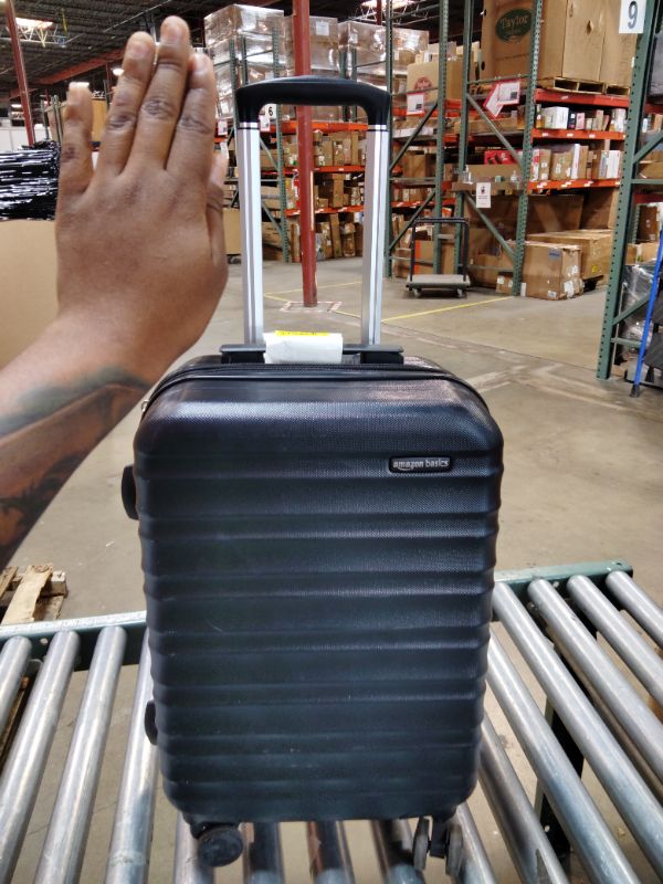 Photo 1 of ***Handle won't close all the way *** Amazon Basics 21" Hardside Carry-On Luggage with Spinner Wheels, Expandable for Up to 25% More Space, Scratch-Resistant Hard Shell, Telescoping Handle, Black