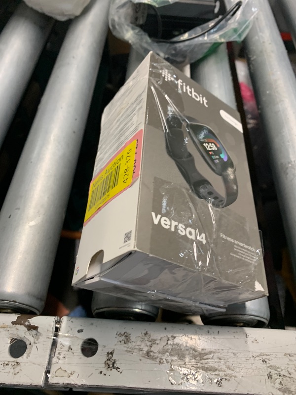 Photo 1 of (MISSING CHARGER) Fitbit Versa 4 Fitness Smartwatch with Daily Readiness, GPS, 24/7 Heart Rate, 40+ Exercise Modes, Sleep Tracking and more, Black/Graphite, One Size (S & L Bands Included)