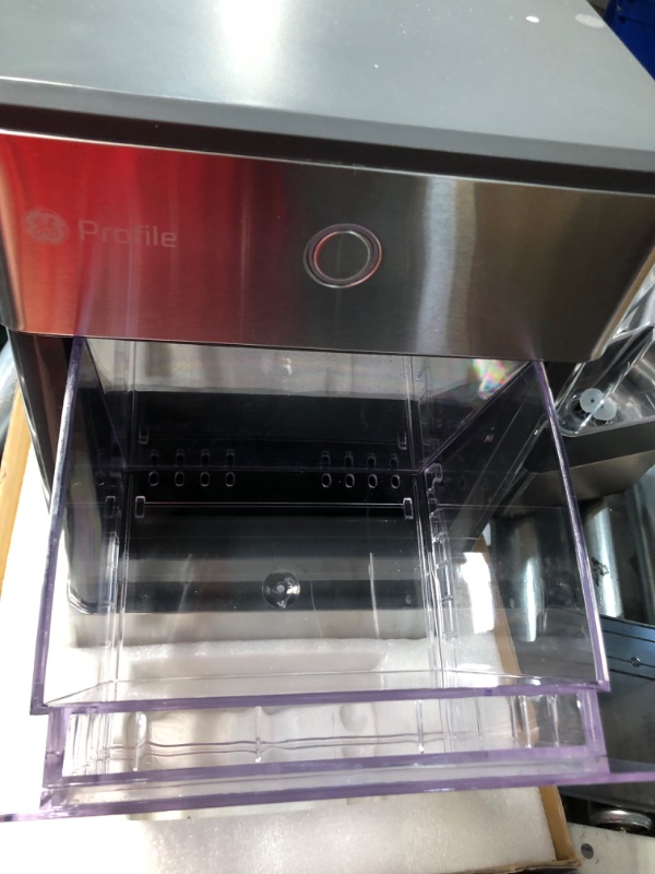 Photo 1 of ***DAMAGED - DENTED - POWERS ON - UNABLE TO TEST FURTHER - LIKELY MISSING PARTS - SEE PICTURES***
GE Profile Opal | Countertop Nugget Ice Maker with Side Tank | Portable Ice Machine with Bluetooth Connectivity for Smart Home Kitchen | Stainless Steel Fini