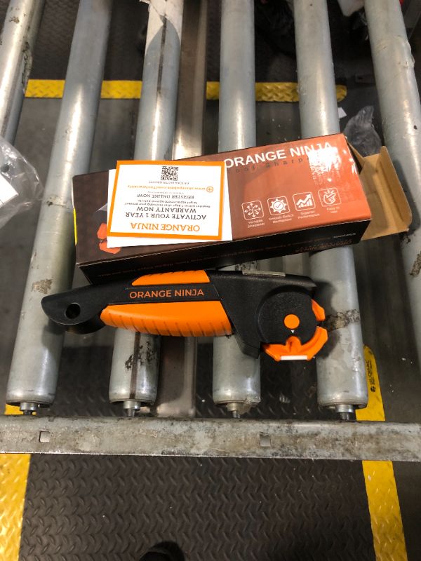 Photo 2 of ***most like new item*** Orange Ninja All-in-1 Garden Tool & Knife Sharpener for Lawn Mower Blade,Scissors, Axe, Hatchet, Machete, Pruner, Hedge Shears by Sharp Pebble