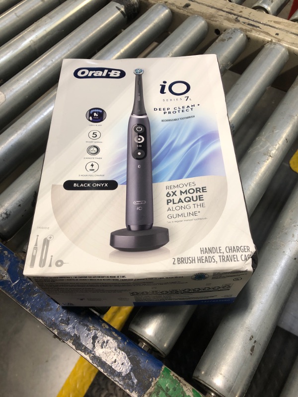 Photo 1 of Oral-B iO Deep Clean + Protect Rechargeable Electric Toothbrush, Black with a iO Series 7 Toothbrush, 2 Replacement Brush Heads, and a Charging Travel Case
