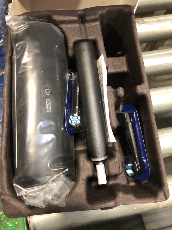 Photo 1 of Oral-B iO Deep Clean + Protect Rechargeable Electric Toothbrush, Black with a iO Series 7 Toothbrush, 2 Replacement Brush Heads, and a Charging Travel Case