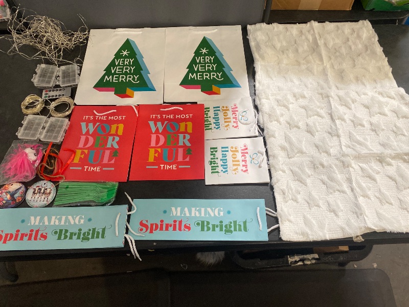 Photo 1 of Christmas Items Bundle | 4  20FT. Christmas Lights, 2 Christmas Tree Ornaments, 10 Spoons for Party, 1 Light Up Spike Ball, 2 White Christmas Tree Pillows, 8 Variety Christmas Bags