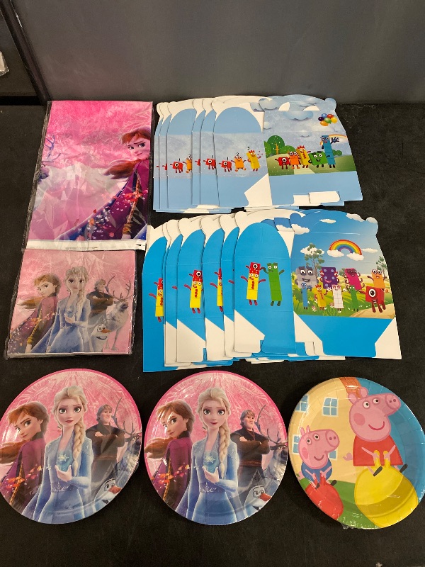 View 2 of Frozen + Animated Characters Party Supplies Bundle | 16 Gift Boxes, 20 Small Frozen Plates, 1 Table Cover, 20 Napkins, 10 Peppa Pig Plates