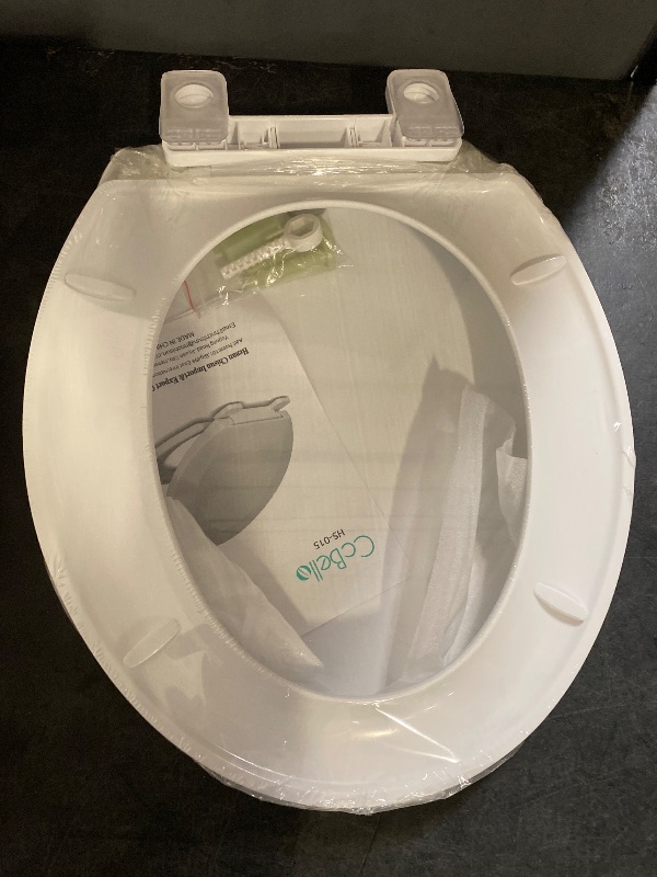 Photo 1 of CCBELLA Elongated Toilet Seat with Built-In Potty Training Seat Toilet Seat for Kids and Adults: 2-in-1 Potty Training, Easy Installation, Quiet Closing, Non-Slip,Stain-Resistant, White 18.5”