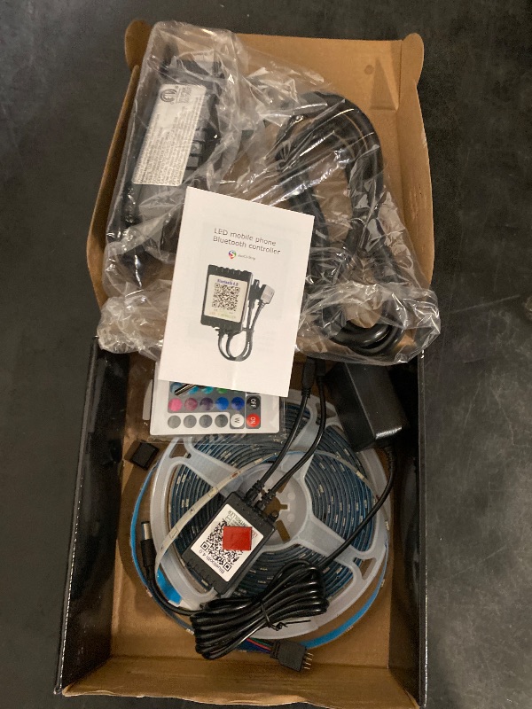 Photo 1 of LED Strip Lights Kit - RGBW Waterproof 16.4ft (5M) with 300 SMD 5050 LEDs, Warm White & Multi-Color, includes 40-Key Remote and 5A Power Supply, Cuttable & Linkable
