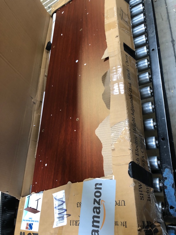 Photo 1 of SHW 55-Inch Large Electric Height Adjustable Standing Desk, 55 x 28 Inches, Cherry