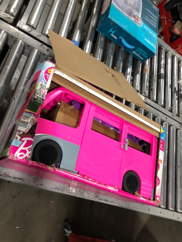 Photo 2 of Barbie Camper Playset, DreamCamper Toy Vehicle with 60 Doll-Sized Accessories Including Furniture, Pool & 30-inch Slide