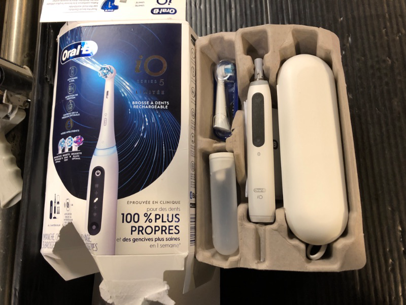 Photo 2 of Oral-B iO Deep Clean + Whiten Rechargeable Electric Toothbrush with Visible Pressure Sensor, 2 Minute Timer, 5 Cleaning Settings, 1 iO5 Limited, 3 Toothbrush Heads, Travel Case & Refill Holder, White