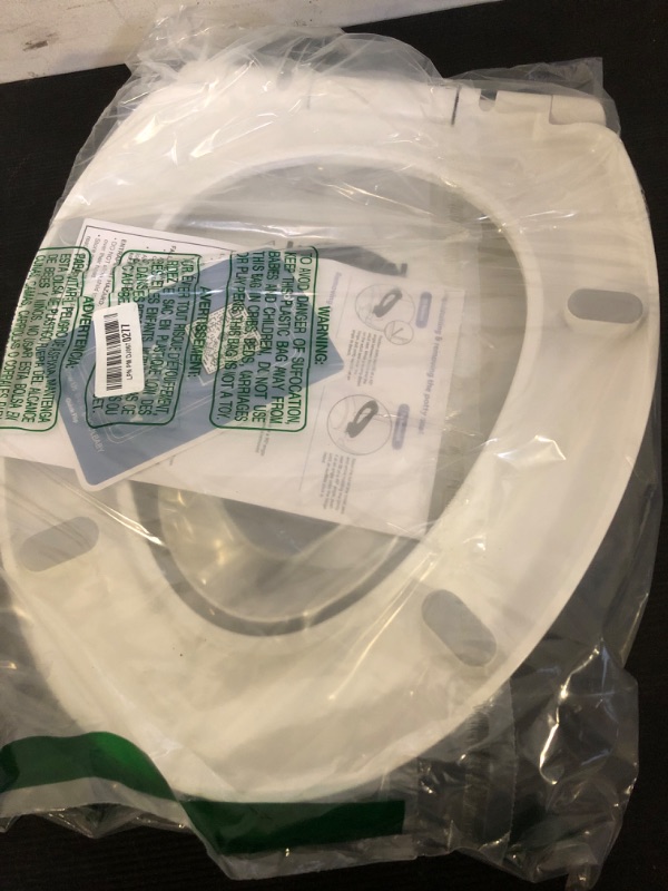 Photo 1 of Quick Flip Round Toilet Seat with Built-In Potty & Splash Guard for Toddler Training, Slow Close - Jool Baby