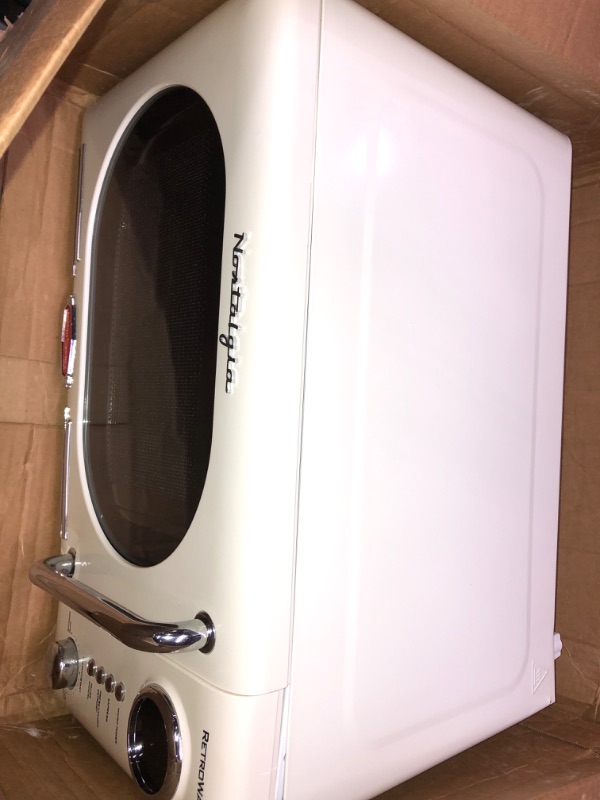 Photo 10 of ***NONREFUNDABLE - THIS SALE FINAL -  PARTS ONLY - SEE COMMENTS***
Nostalgia Retro Compact Countertop Microwave Oven - 0.7 Cu. Ft. - 700-Watts with LED Digital Display - Child Lock - Easy Clean Interior - Cream