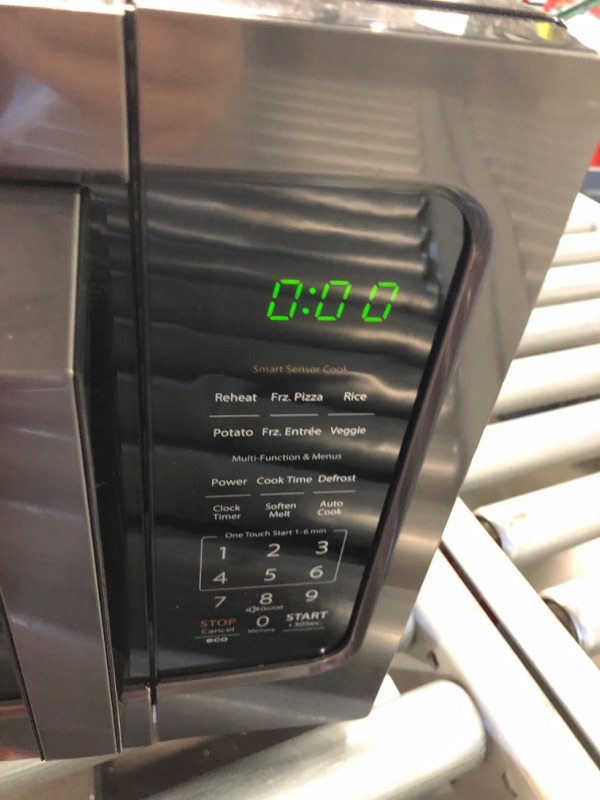 Photo 1 of ***DAMAGED - DENTED - POWERS ON - UNABLE TO TEST FURTHER - SEE PICTURES***
TOSHIBA ML-EM45P(BS) Countertop Microwave Oven with Smart Sensor and Position Memory Turntable