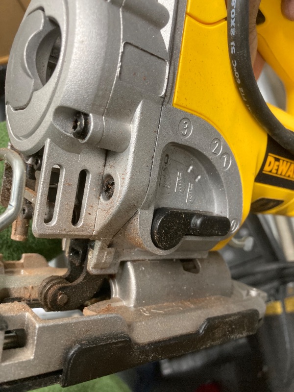 Photo 1 of DEWALT 6.5 Amp Corded Variable Speed Jig Saw Kit with Kit Box -Pre-Owned saw residue appears to be used,Cord cut slightly, Not Tested 