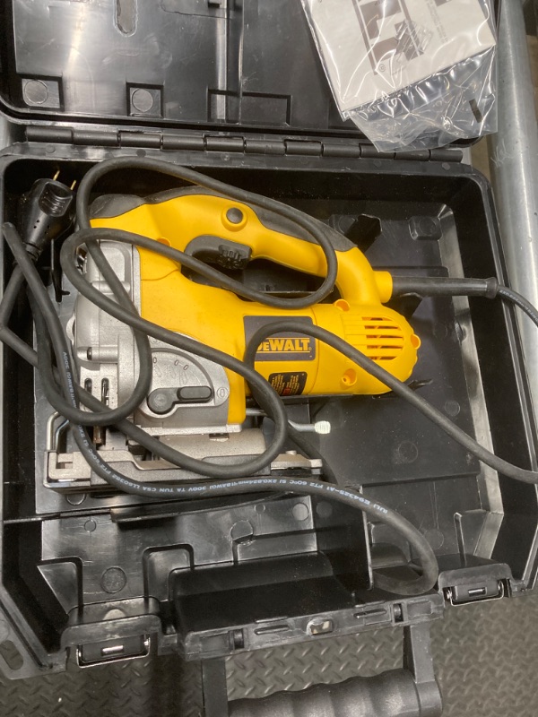 Photo 1 of DEWALT 6.5 Amp Corded Variable Speed Jig Saw Kit with Kit Box -Pre-Owned saw residue appears to be used,Cord cut slightly, Not Tested 