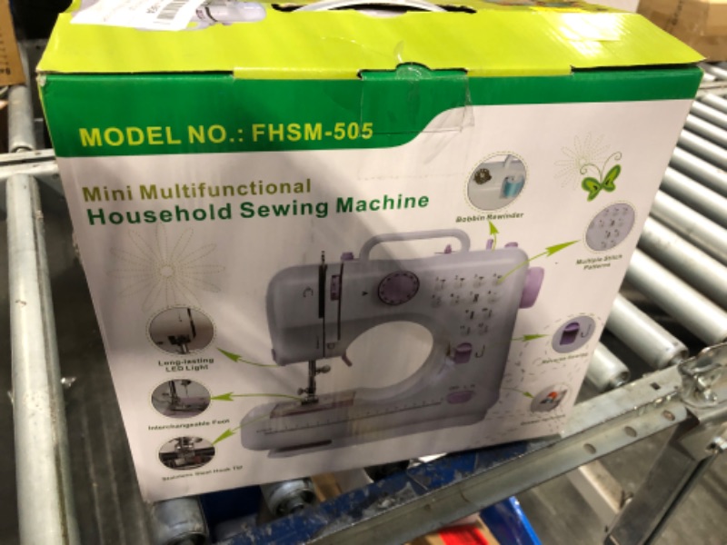 Photo 1 of Stoigeld Sewing Machine for Beginners,Portable Sewing Machine with 12 Built-in Stitches,2 Speed(High-Low Speeds),2 Power Supply Method,20 Pcs Fabric and 32 Pcs Sewing Threads Kit,- (White and Purple)