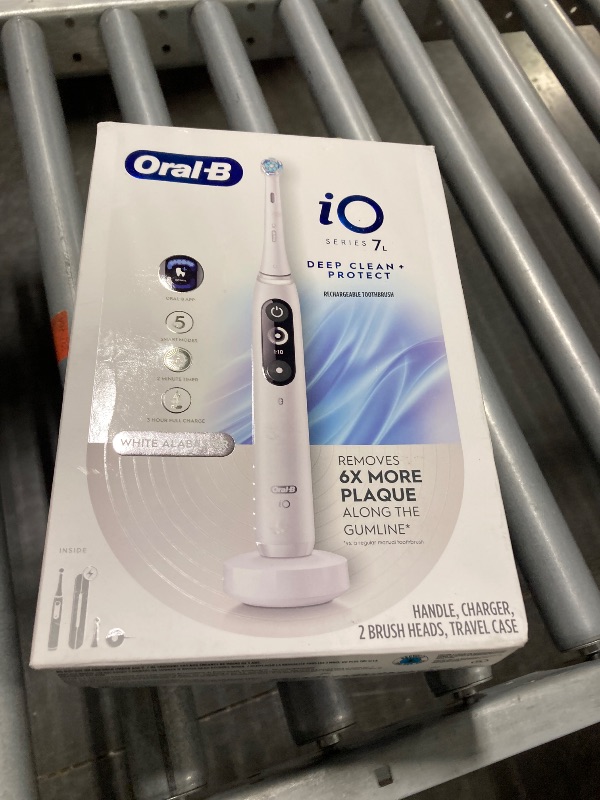 Photo 2 of ***FINAL SALE, NO RETURNS, PARTS ONLY***Oral-B iO Deep Clean + Protect Rechargeable Electric Toothbrush, White with a iO Series 7 Toothbrush, 2 Replacement Brush Heads, and a Charging Travel Case