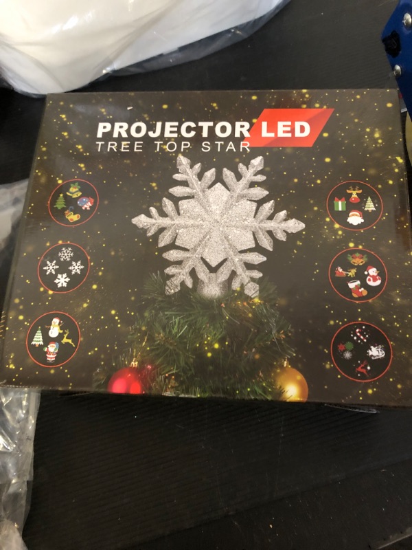 Photo 1 of Mrrihand Christmas Tree Topper Lighted with 6 Projection Modes, Built-in 360° LED Rotating Projector Christmas Tree Star, 3D Snowflake Design for Xmas Holiday Christmas Tree Decoration-Silver