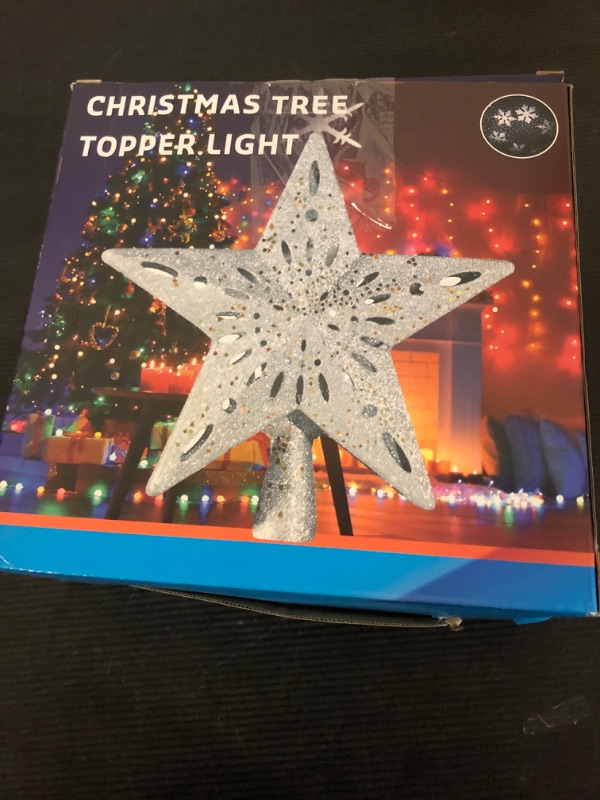 Photo 1 of DG-Direct Christmas Tree Topper Lighted Star [Silver],3D Hollow Sparkling Star Christmas Tree Topper with Rotating Magic Cool White Snowflake Projector for Christmas Tree Ornament (Silver)