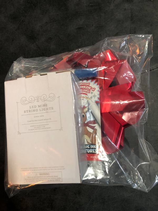Photo 1 of Christmas Items  - White Christmas Lights, 1 Big Bow, 1 Kids Activity Book 