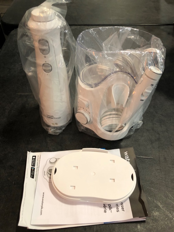 Photo 1 of Waterpik Ultra Plus and Cordless Pearl Water Flosser Combo Pack