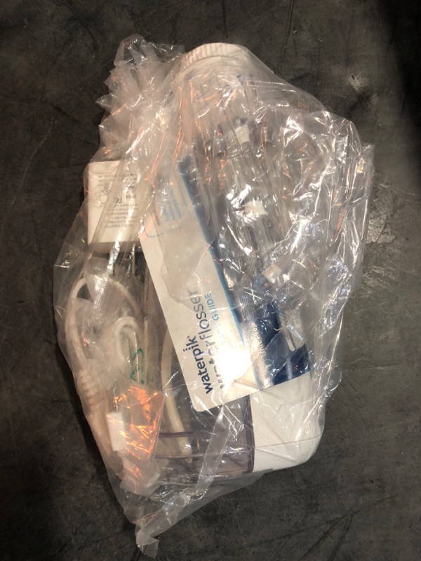 Photo 1 of USED Waterpik Ultra Plus and Cordless Pearl Water Flosser Combo Pack
