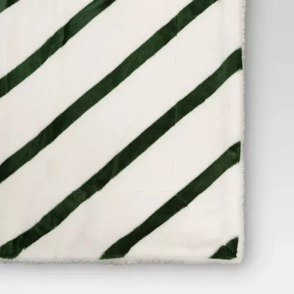 Photo 3 of Candy Cane Striped Printed Plush Throw Blanket with Faux Shearling Reverse Ivory/Green - Threshold™