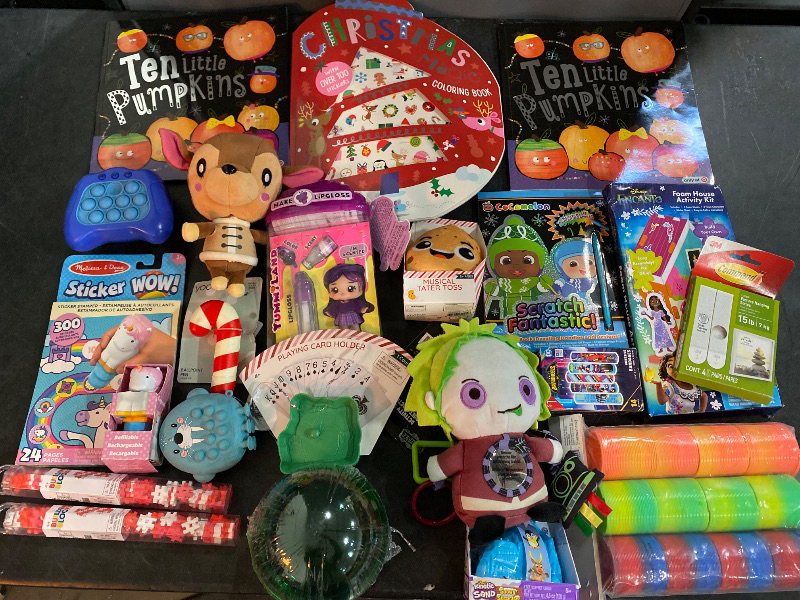 Photo 1 of 21 Item Toys & Games, Home Essentials | 2cT. Ten Little Pumpkins Paperback, Fast Push Machine Light Up Fidget Toys for Kids, Animal Crossing New Leaf Fauna Plush 7", Novelty Ballpoint Pen Candy Cane, 2CT. Mini Building Blocks, 24-Page Activity Pad and Sti