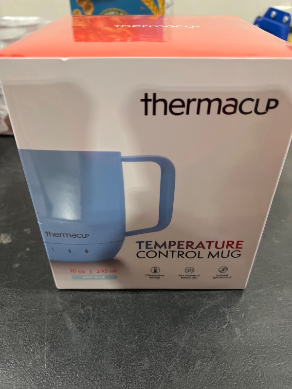 Photo 1 of Thermacup Self-Heating Temperature Controlled Coffee Mug with Lid, Led Electric Smart Cup, 3 Custom Heat Settings, Auto/Off Feature, Keeps Liquids Warm, Sip Smarter (Mist Blue – 10 oz)
