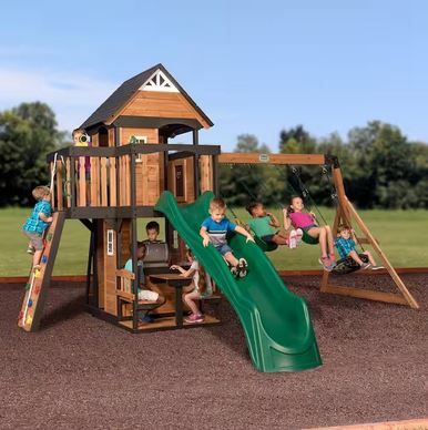 Photo 1 of Backyard Discovery Canyon Creek All Cedar Swing Set Playset w/ Rockwall Upper Fort Belt Swings Web Swing Green Wave Slide, and Play Kitchen