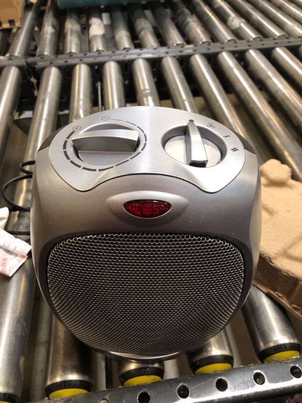 Photo 1 of Amazon Basics 1500W Ceramic Indoor Personal Space Heater with Adjustable Thermostat, Silver, 7.52"D x 6.34"W x 9.45"H
