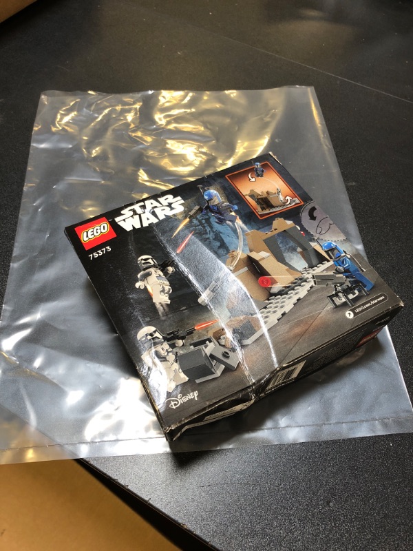 Photo 2 of **SOLD FOR PARTS**
LEGO Star Wars: The Mandalorian Ambush on Mandalore Battle Pack, Building Toy with 4 Star Wars Minifigures, Collectible Brick Built Playset, Star Wars Gift Idea for Boys and Girls Ages 6 and Up, 75373
box is damaged 